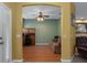 Cozy sitting room with wood floors, neutral walls, and ceiling fan at 15287 Coot Rd, Weeki Wachee, FL 34614