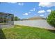 Spacious backyard with well-maintained lawn and privacy fence, ideal for recreation and relaxation at 15569 Burbank Dr, Brooksville, FL 34604