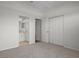 Bedroom features neutral carpet and ensuite bathroom at 15569 Burbank Dr, Brooksville, FL 34604
