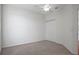 Bedroom featuring neutral carpet, a ceiling fan, and a double door closet at 15569 Burbank Dr, Brooksville, FL 34604