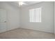 Bedroom featuring neutral carpet, a ceiling fan, and a window at 15569 Burbank Dr, Brooksville, FL 34604