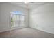 Bedroom with carpet, large window and natural light at 15569 Burbank Dr, Brooksville, FL 34604