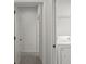 Hallway leading to laundry area with washer and dryer included at 15569 Burbank Dr, Brooksville, FL 34604