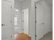 Hallway showing transition between the hardwood floors to carpeted rooms at 15569 Burbank Dr, Brooksville, FL 34604