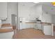 Spacious open kitchen featuring tile flooring and plenty of cabinet space at 15569 Burbank Dr, Brooksville, FL 34604