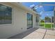 The tiled patio boasts a screened enclosure and sliding glass doors for seamless indoor/outdoor living at 15569 Burbank Dr, Brooksville, FL 34604