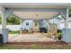 Inviting backyard boasts covered patio with ample seating, ideal for entertaining at 1601 E 98Th Ave, Tampa, FL 33612