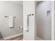 Bright bathroom with white subway tiled shower and sleek black hardware at 1601 E 98Th Ave, Tampa, FL 33612