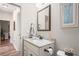 Bathroom featuring a vanity sink with a framed mirror at 1601 E 98Th Ave, Tampa, FL 33612