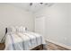 Bedroom boasts bright walls, wood-look floors, and a double door closet at 1601 E 98Th Ave, Tampa, FL 33612