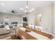 Open-concept living and dining area with a cozy sofa and stylish decor at 1601 E 98Th Ave, Tampa, FL 33612