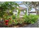 Vegetable garden featuring tomatoes, herbs, and healthy soil behind the house, providing fresh produce at 1601 E 98Th Ave, Tampa, FL 33612