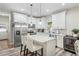 Modern kitchen featuring white cabinets, stainless steel appliances, and a center island at 1601 E 98Th Ave, Tampa, FL 33612