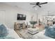 Open-concept living room offering a view of the kitchen, dining area, and backyard at 1601 E 98Th Ave, Tampa, FL 33612