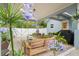Inviting patio with outdoor seating, grilling area, and beautiful flowers, perfect for relaxing and entertaining at 1601 E 98Th Ave, Tampa, FL 33612
