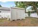 Outdoor shed with backyard, offering extra storage space at 1601 E 98Th Ave, Tampa, FL 33612
