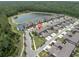 Aerial view of community homes near lake; the listing has a red pin for location at 17316 Cruiser Bnd, Land O Lakes, FL 34638