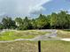 Bike park in the Bexley community featuring a small BMX course and lush green grass at 17316 Cruiser Bnd, Land O Lakes, FL 34638