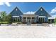 Clubhouse view showcasing a covered entry, brick walkway, and benches at 17316 Cruiser Bnd, Land O Lakes, FL 34638