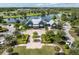 Beautiful community clubhouse overlooking a serene lake with lush landscaping and gathering areas at 17316 Cruiser Bnd, Land O Lakes, FL 34638