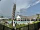 View of the Bexley community swimming pool and pool house at 17316 Cruiser Bnd, Land O Lakes, FL 34638