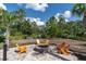 Cozy outdoor fire pit with comfortable Adirondack chairs, perfect for gathering and relaxing at 17316 Cruiser Bnd, Land O Lakes, FL 34638
