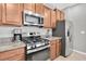 Close up of kitchen showing stainless steel appliances and granite countertops at 17316 Cruiser Bnd, Land O Lakes, FL 34638