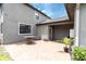 Inviting patio area with a barrel table, seating, and a well maintained brick floor at 17316 Cruiser Bnd, Land O Lakes, FL 34638
