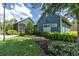 Inviting swim club building with lush landscaping, offering a refreshing oasis for residents at 17316 Cruiser Bnd, Land O Lakes, FL 34638