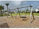 A set of swings at a playground in the Bexley community at 17316 Cruiser Bnd, Land O Lakes, FL 34638