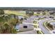 Aerial view of homes and golf course, showcasing community layout and proximity to recreational facilities at 17679 Garsalaso Cir, Brooksville, FL 34604