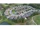 Aerial view of home located on a corner lot in a community with mature trees and a pond at 17679 Garsalaso Cir, Brooksville, FL 34604