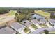 High-angle shot of residences alongside a golf course and a tranquil pond at 17679 Garsalaso Cir, Brooksville, FL 34604