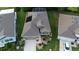 An aerial shot showcases a lovely single Gathering home with a manicured lawn at 17679 Garsalaso Cir, Brooksville, FL 34604