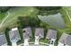 Beautiful aerial view of home with golf course, pond, and mature trees in the background at 17679 Garsalaso Cir, Brooksville, FL 34604