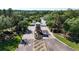 Aerial shot of a community entrance displaying lush landscaping, guardhouse, and welcoming entrance at 17679 Garsalaso Cir, Brooksville, FL 34604