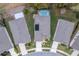 Birds-eye view of neighborhood homes with neat yards and driveways at 17679 Garsalaso Cir, Brooksville, FL 34604