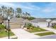 Charming single-story home featuring a two-car garage and beautifully landscaped front yard at 17679 Garsalaso Cir, Brooksville, FL 34604
