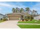 Beautiful single-story home with a well-manicured lawn and a two-car garage at 17679 Garsalaso Cir, Brooksville, FL 34604