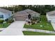 Charming single-Gathering home featuring a well-manicured front yard and a two-car garage at 17679 Garsalaso Cir, Brooksville, FL 34604