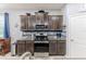 Updated kitchen featuring granite countertops, a stylish backsplash, and stainless steel appliances at 17679 Garsalaso Cir, Brooksville, FL 34604
