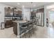 Modern kitchen features granite countertops, breakfast bar seating, and stainless steel appliances at 17679 Garsalaso Cir, Brooksville, FL 34604