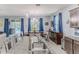 Open-concept design showcases a kitchen, dining area with access to an outdoor pool and seating at 17679 Garsalaso Cir, Brooksville, FL 34604