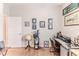 Spacious office area showcasing wood-look flooring, golf decor, and ample workspace at 17679 Garsalaso Cir, Brooksville, FL 34604