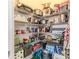 Organized walk-in pantry with ample shelving for storage and accessibility at 17679 Garsalaso Cir, Brooksville, FL 34604