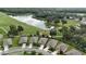 A birds eye view of a single story home, situated on a golf course with a nearby pond at 17727 Garsalaso Cir, Brooksville, FL 34604