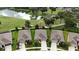 Aerial view of a well-maintained single story home located near a golf course and a pond at 17727 Garsalaso Cir, Brooksville, FL 34604