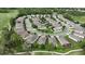An aerial view of a one story home located in a community near a golf course at 17727 Garsalaso Cir, Brooksville, FL 34604