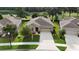 Well maintained single-story home with a two car garage, beautiful landscaping, and a view of the golf course at 17727 Garsalaso Cir, Brooksville, FL 34604