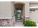Charming front entrance with decorative door, stone accents, and inviting decor at 17727 Garsalaso Cir, Brooksville, FL 34604